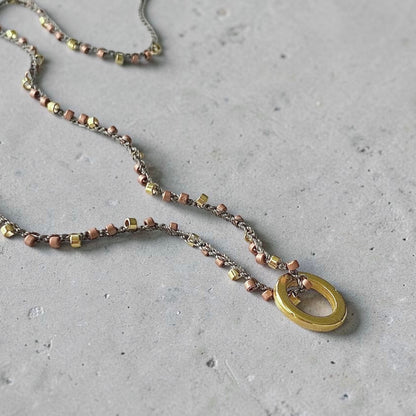 Collar tejido argolla oro