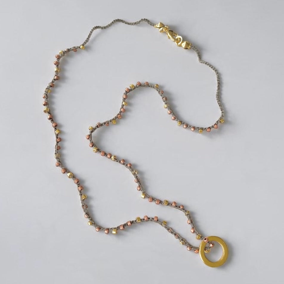 Collar tejido argolla oro