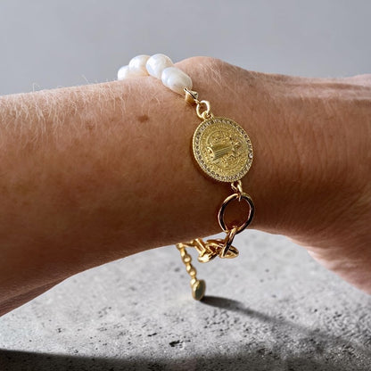 Pulsera perlas San Benito oro
