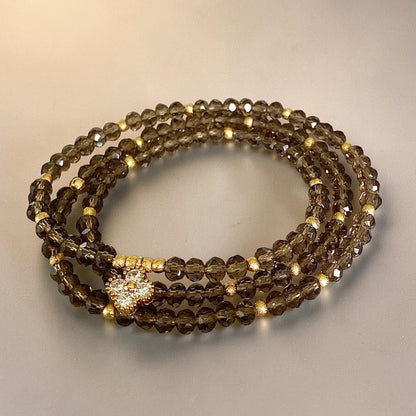 Pulsera cristales fumé oro