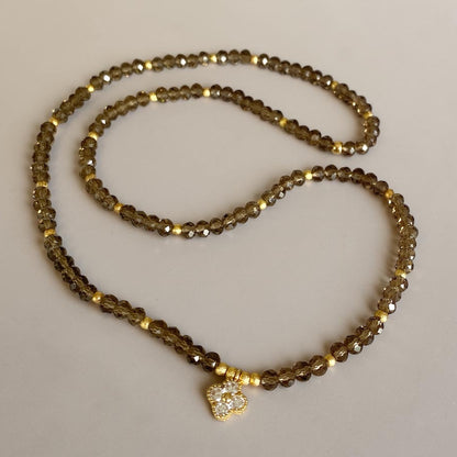 Pulsera cristales fumé oro