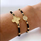 Pulsera hilo trébol bolitas oro